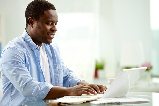 Image of man at a laptop.